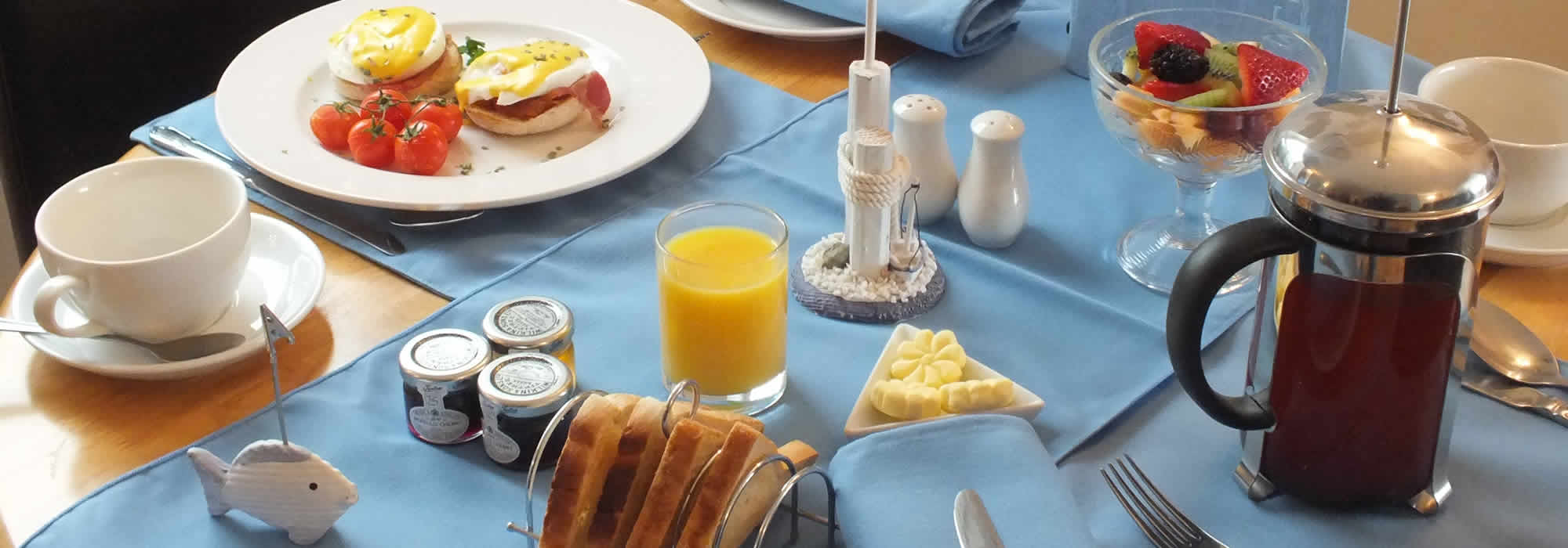 Table with breakfast served at The Watermark in Looe, Cornwall